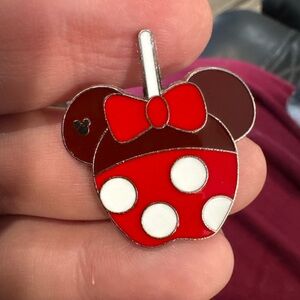 Disney Hidden Mickey pin shaped like a lollipop featuring Minnie Mouse.